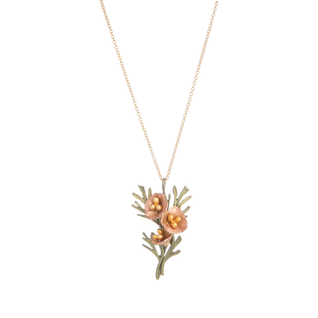 This golden pendant necklace features a cluster of three poppies and delicate, frondlike leaves. Materials: hand-finished cast sterling silver with 24K gold-plated petals and leaves Bronze chain Adjustable chain length: 16" Pendant size: 1.7"