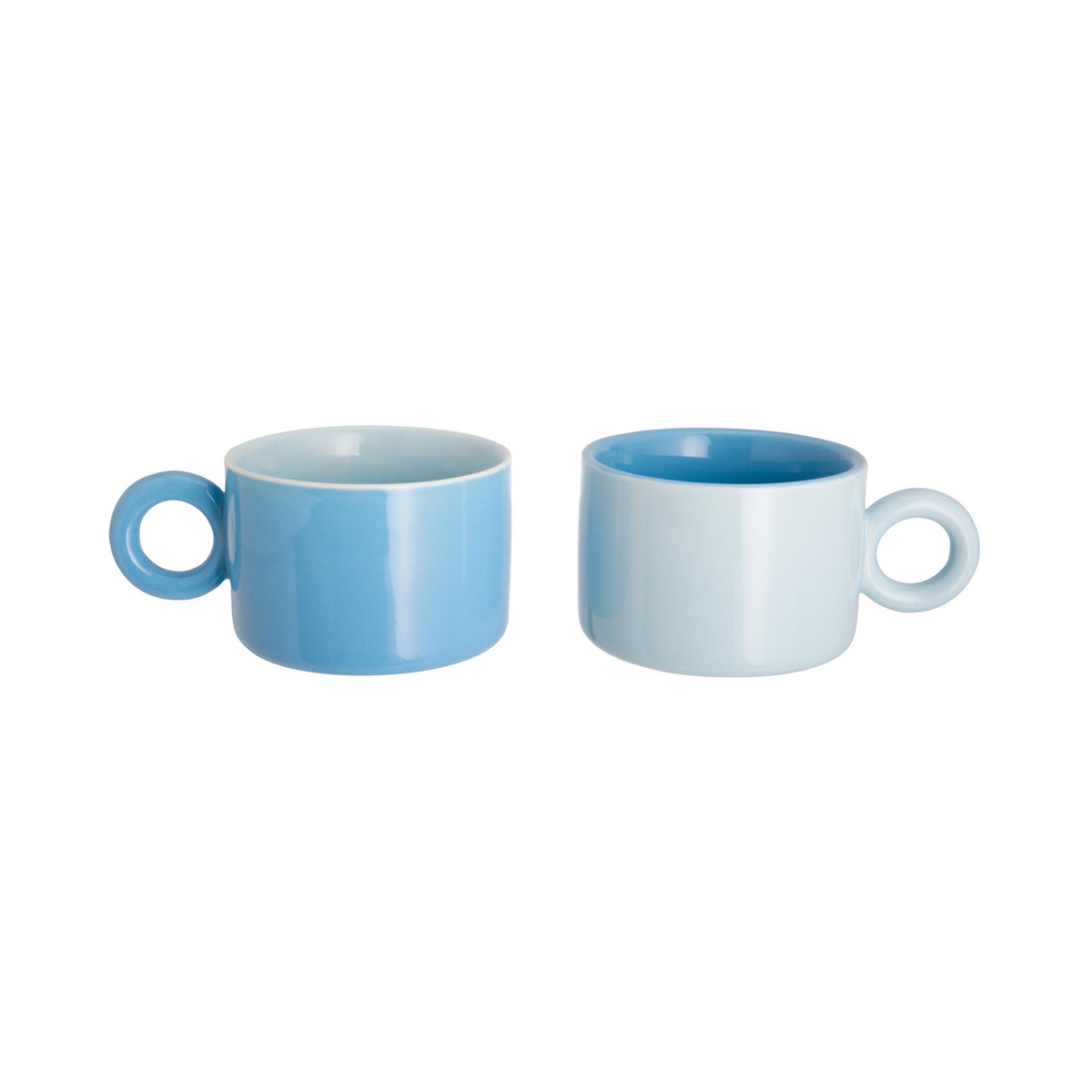 Two light blue ceramic mugs on a white background