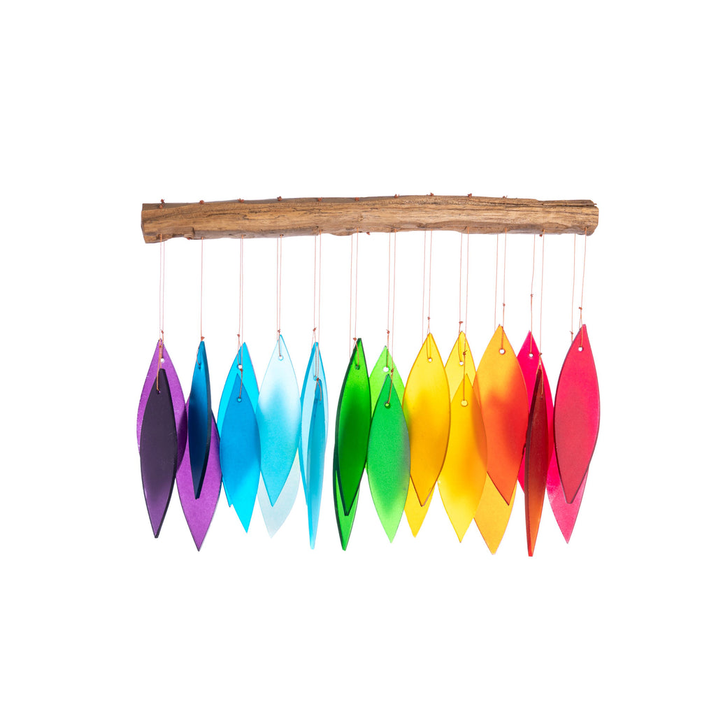 This charming chime is anything but the same old thing! Featuring beautifully colored glass, they are equally at home in the wind or when used as decor in a nursery or by a window. The wood is collected from fallen coffee and teak trees by Balinese Villagers. Measures approx: 1 x 10.5 x 16 inches.