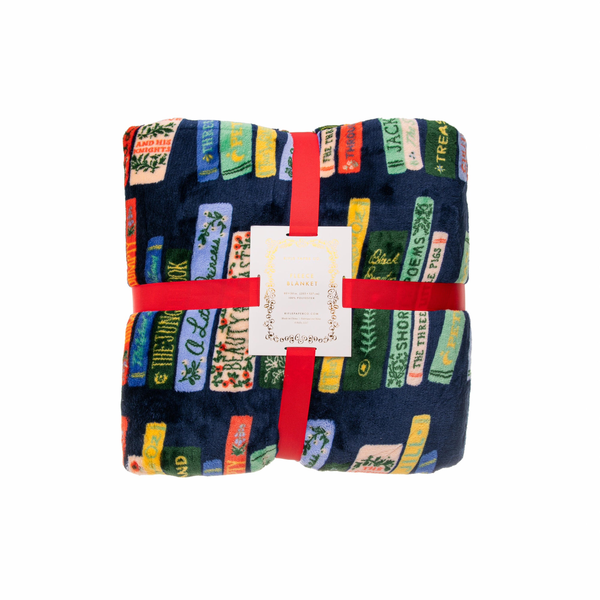 Folded blanket with colorful text pattern and red binding on a white background