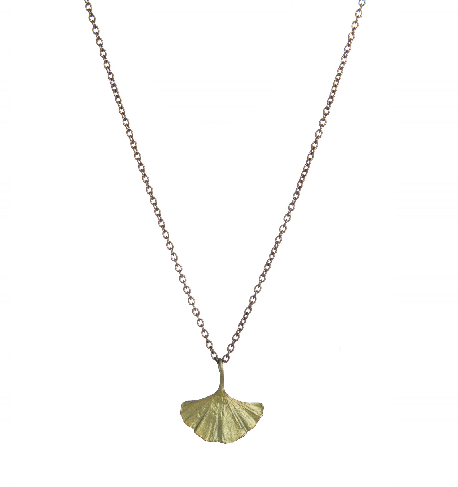 Ginkgo trees are one of the world's oldest tree families, dating back to when dinosaurs roamed the earth. It is celebrated in the fall, when its leaves turn a brilliant golden yellow. This single Ginkgo leaf is cast in bronze and is threaded onto a fine brass chain. Chain - 17" to 18" adjustable. Pendant" 0.75" x 0.75"