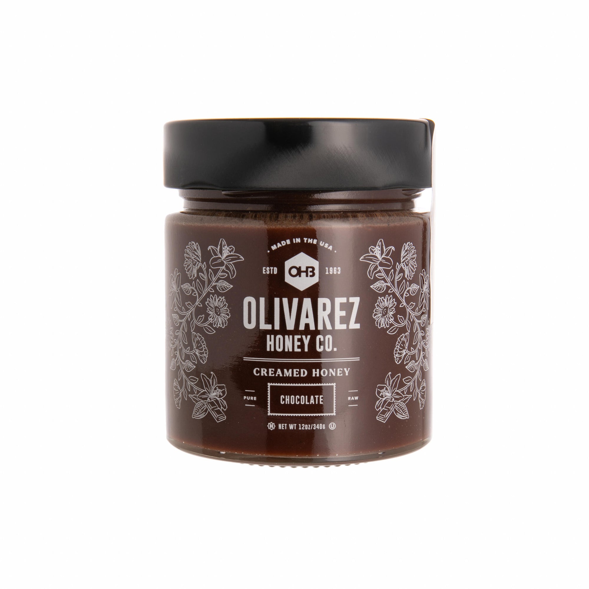 Jar of Olivarez Honey Co. creamed honey on a white background