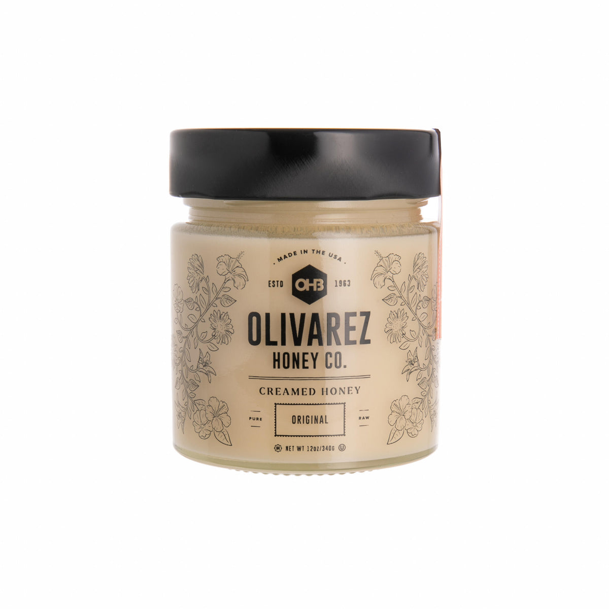 Jar of Olivarez Honey Co. creamed honey on a white background