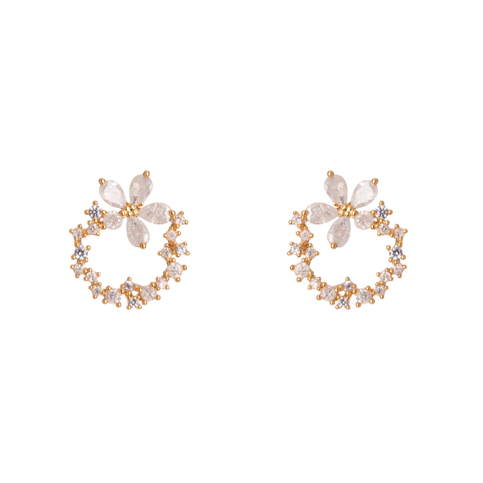 Pair of gold hoop earrings with floral designs on a white background