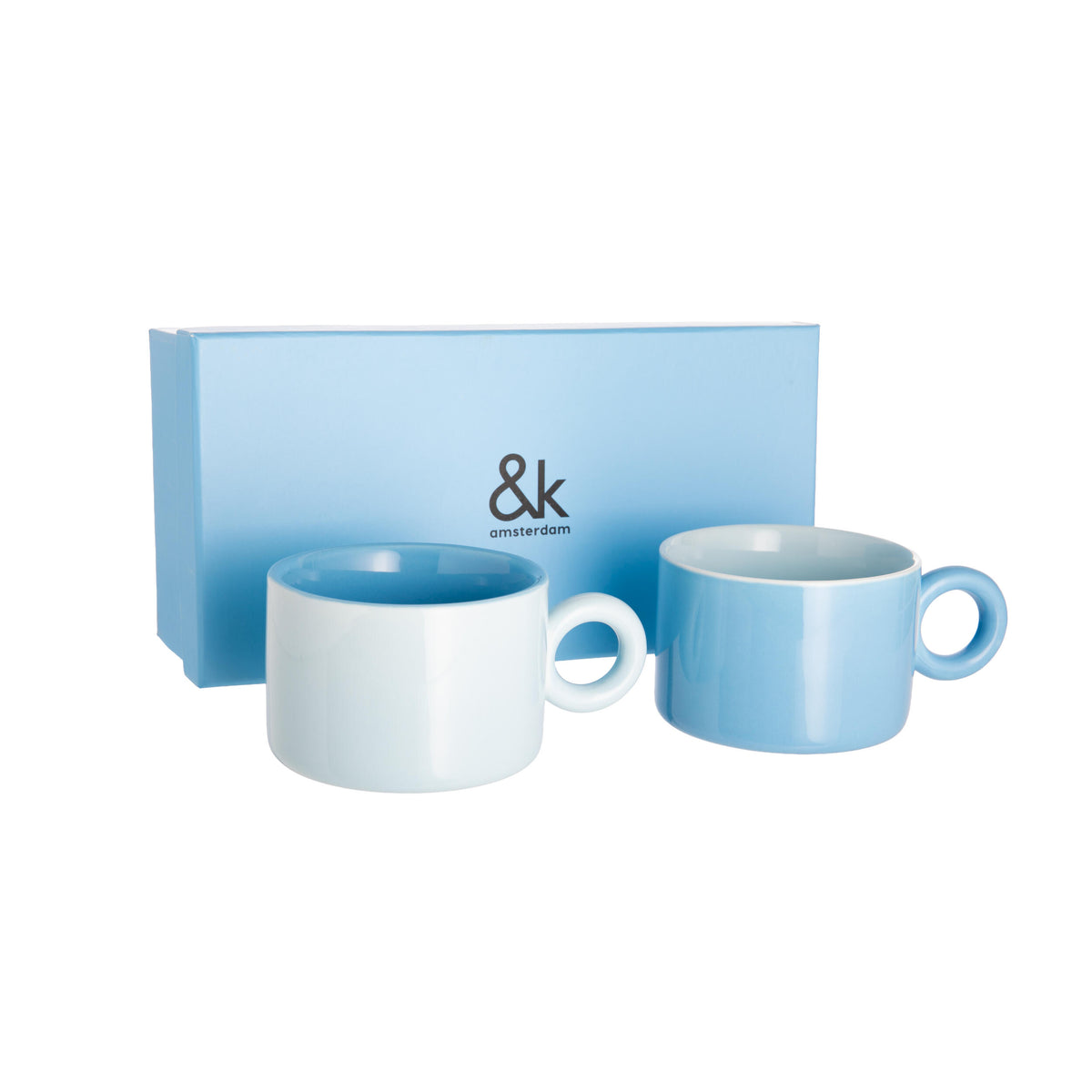 Two blue ceramic mugs with a matching box featuring the brand '&k' on a white background.