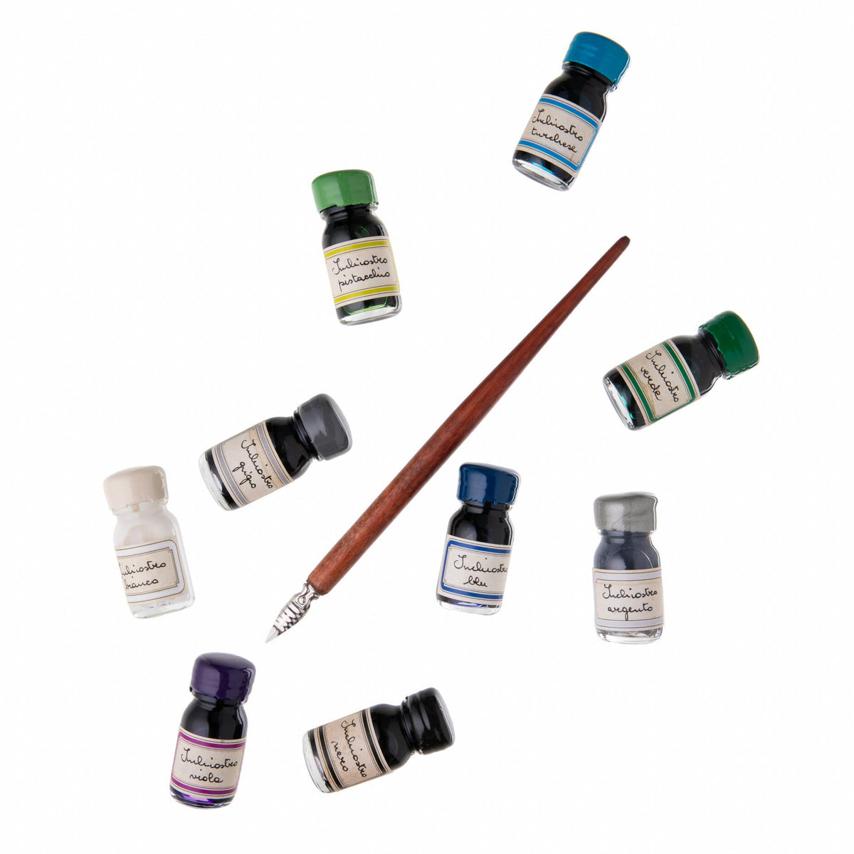Set of ink bottles and a brush on a white background