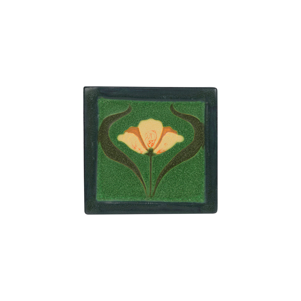 Decorative tile with floral design on a green background
