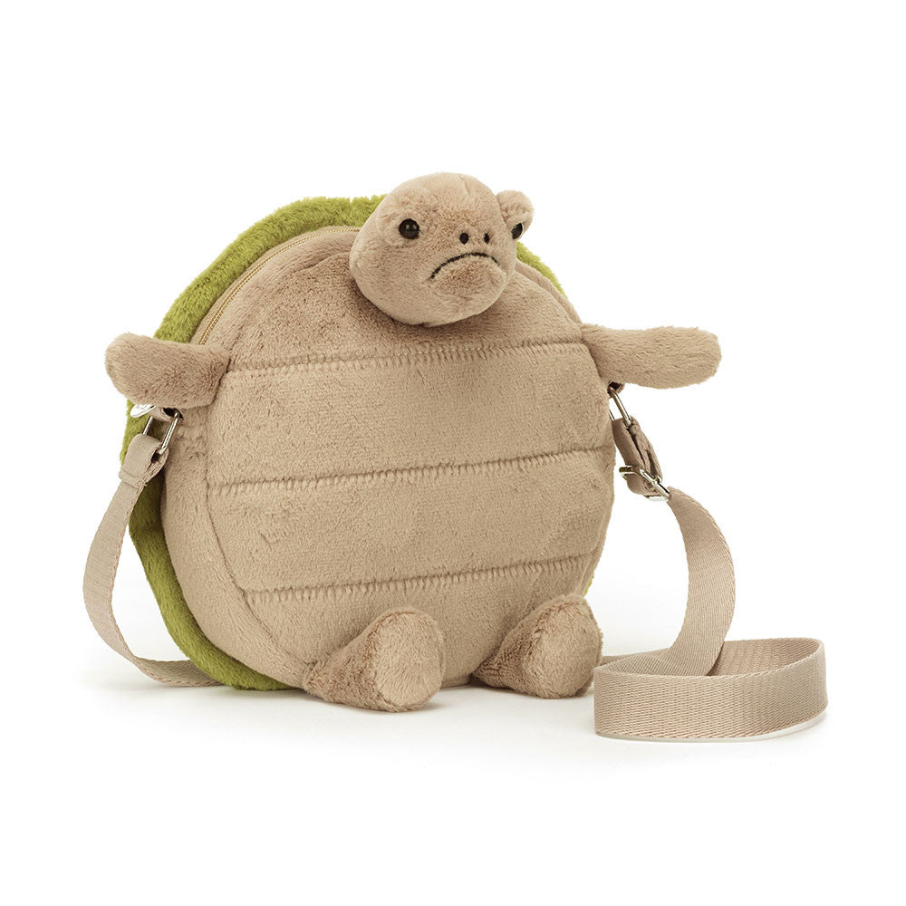 The Timmy Turtle Bag is charmingly grumpy, with a textured beige tum and embroidered green shell. The strong webbed strap will keep Timmy safe riding on a shoulder. This bag holds everything but grudges! Size: 10.2" x 8.7" x 2". Strap 42".  3 years + due to long strap. This item is not a toy.