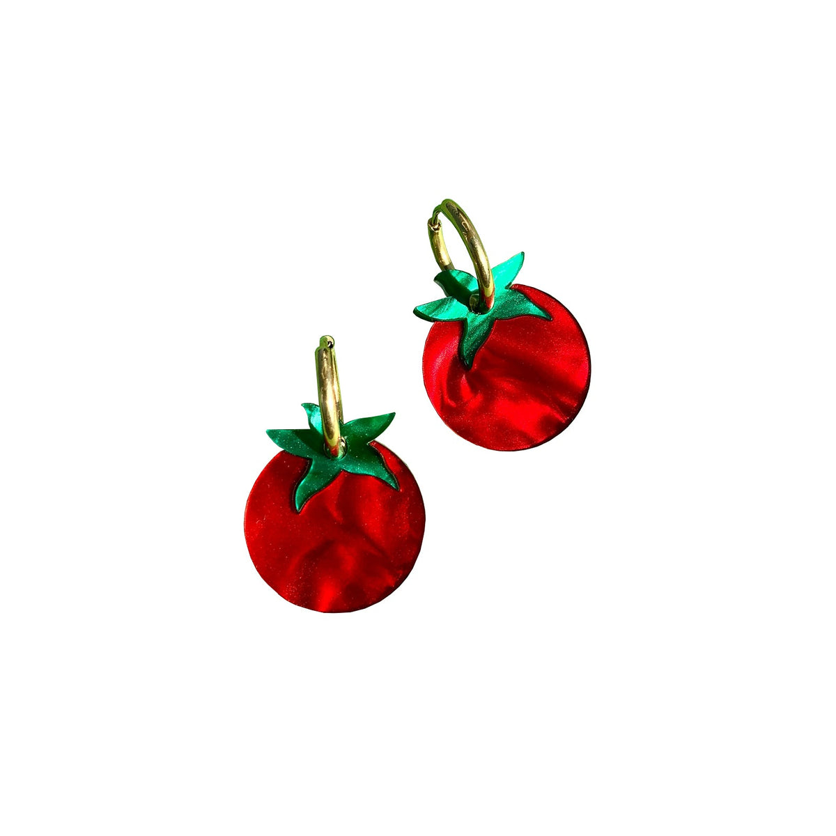 Red tomato-shaped earrings with green leaves on a white background