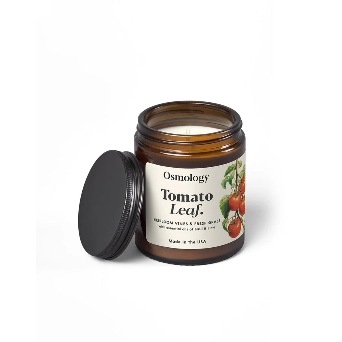 Osmology Tomato Leaf candle with label on a white background