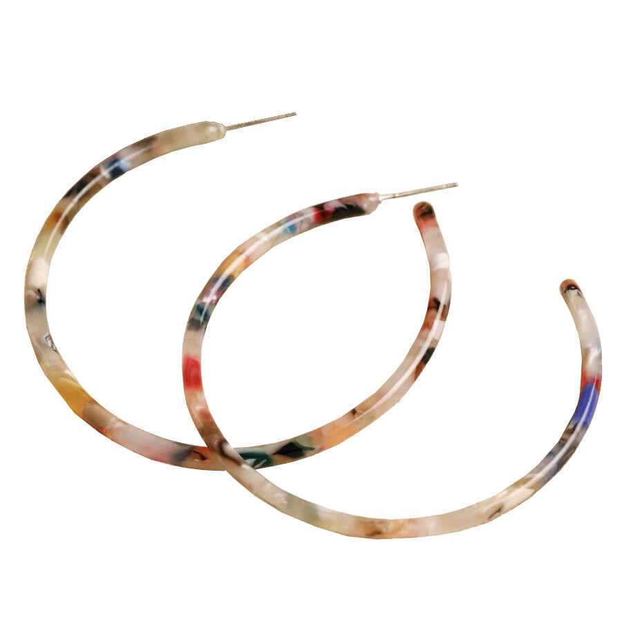Make a statement with these gorgeous hoop earrings. Bold in color, you'll love these fun and unique hoop earrings made of resin, with a tortoiseshell design featuring red, blue, green, pink, orange, and other bright colors. Butterfly backs and hypoallergenic sterling silver posts. Dimensions: 1.5" x 1.5".