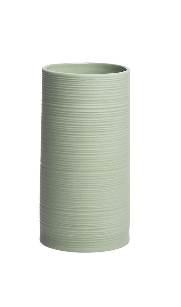 This stoneware cylinder-shaped vase offers a simple and elegant solution for floral decorations and effortlessly elegant arrangements. This minimalist style will add a chic and modern accent to any table shelf whether filled with flowers, or as a stand-alone decor piece.  Stoneware vase. Dimensions: 3" diameter, 6" tall.
