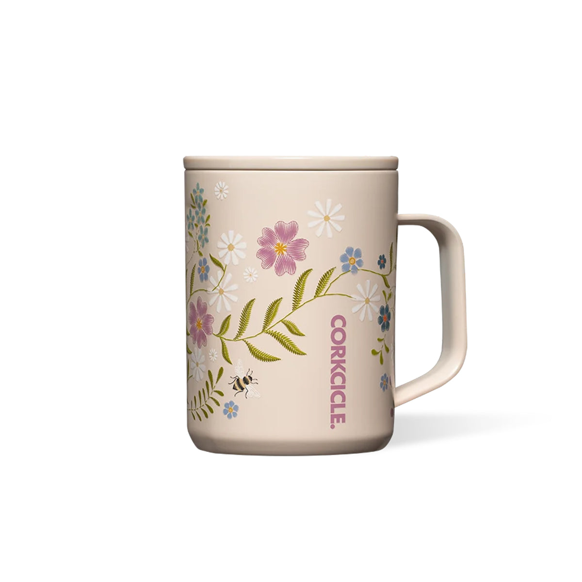A beige ceramic mug with a floral and bee pattern, featuring the brand name 'CORKCILE' printed vertically in pink on the side, set against a plain white background.