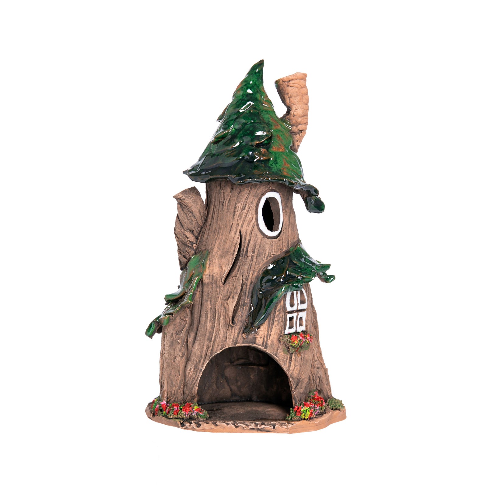 This charming two-story fairy house is crafted entirely by hand in an artisan ceramics studio in Lithuania. Place a tea-light or cone incense inside the opening at the back, and the light will glow through the windows, and the smoke will gently swirl out of the artfully crooked chimney.  8" x 4".