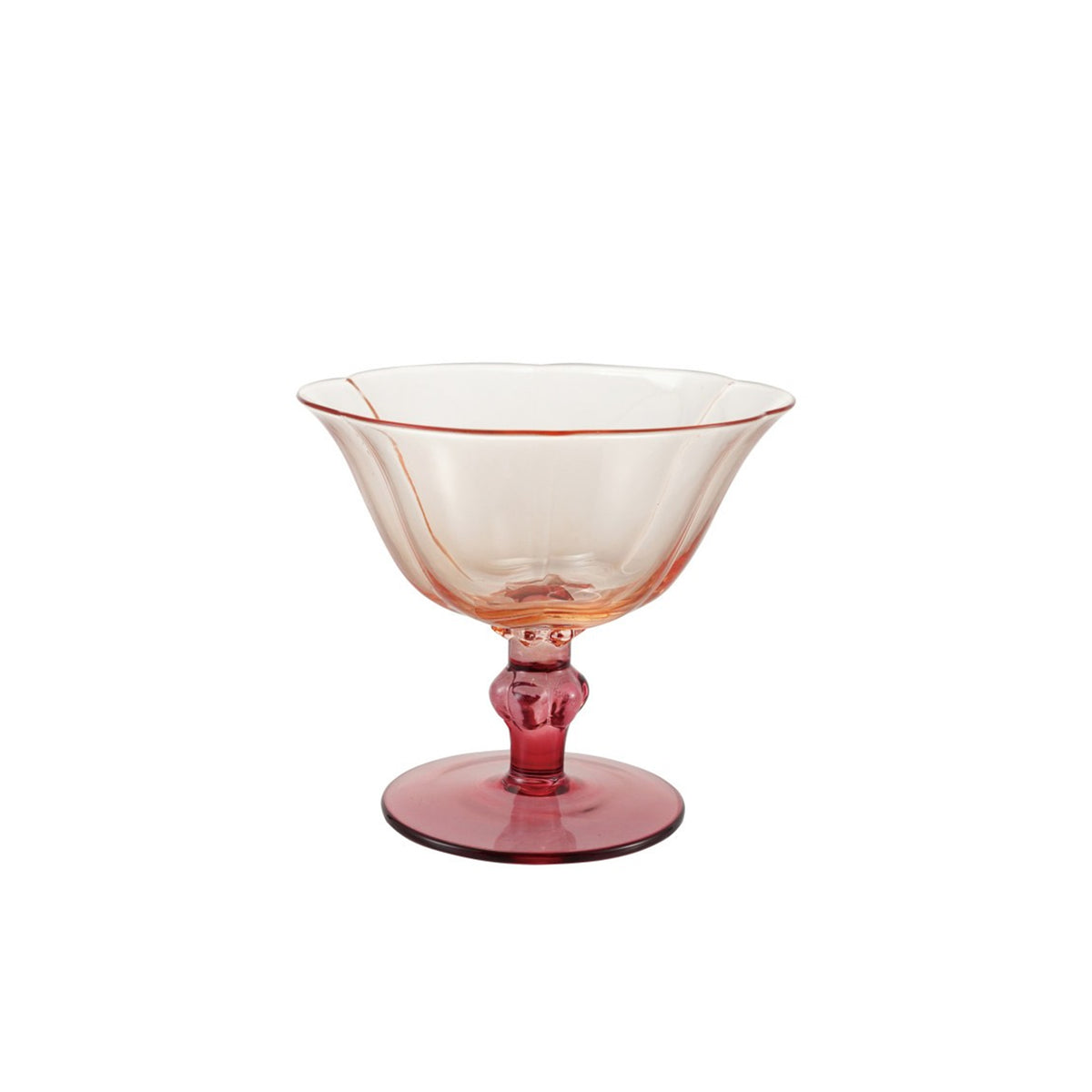 Pink flower shaped short stem wine glass on a white background