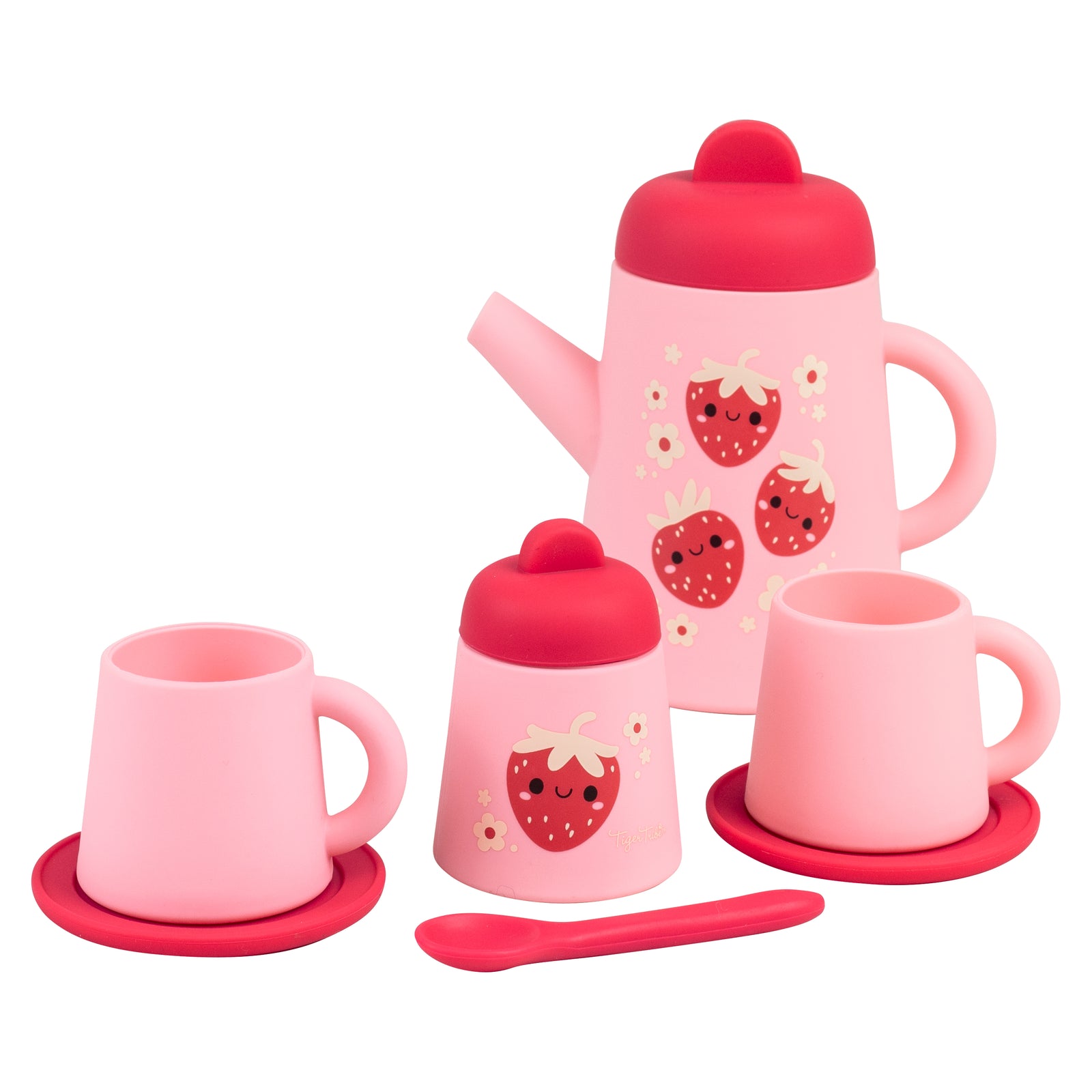 A pink and red silicone tea set with strawberry designs, including a teapot, cups, saucers, a sugar bowl, and a spoon.