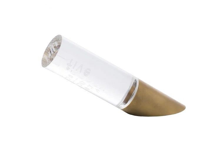 This simple yet clever 'undial' serves as a free-standing sundial. As sunlight passes through a cylindrical lens, the ever-changing time is projected onto the table. Materials: Acrylic, Brass. Designed in Japan by Atsuhiro Hayashi. Dimensions: 5.7" x 2.8" x 4.1".