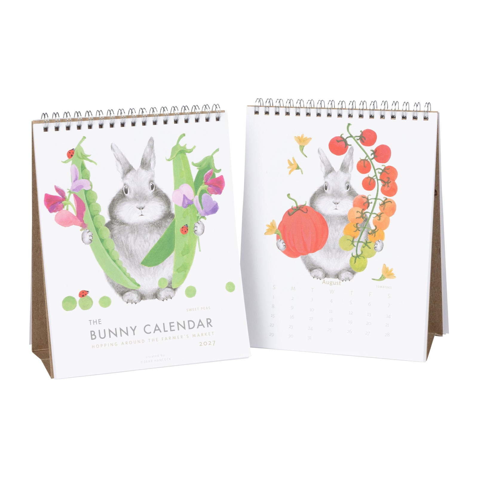 A spiral-bound desk calendar shown open to display both front and back covers. The cover features a gray bunny emerging from a green pea pod with pink flowers and ladybugs.