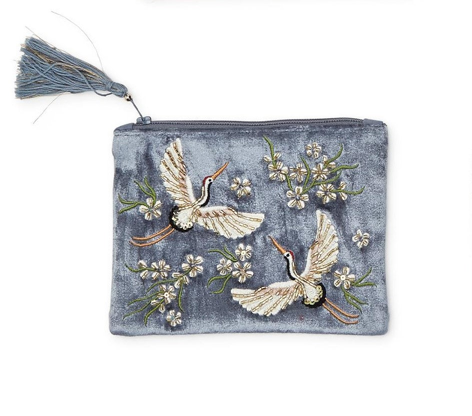 This luxurious zipper purse can be used for a variety of purposes. Made from high-quality velvet material that adds a sophisticated touch to the design. Features a pair of intricately embroidered Heron's with sparkling bead embellishments, and a decorative tassel. Adds a touch of elegance to any outfit. 5" x 7".