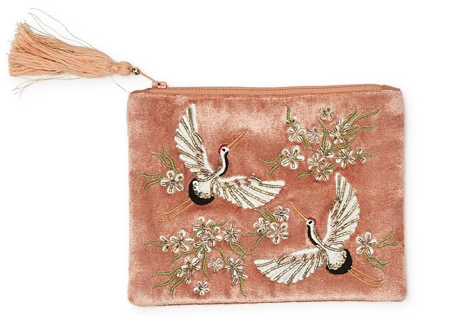 This luxurious and elegant zipper purse can be used for a variety of purposes. Made from high-quality velvet material that adds a plush and sophisticated touch to the design. Features a pair of intricately embroidered Heron's with sparkling bead embellishments, and a decorative tassel. Dimensions: 5" x 7" Spot clean.