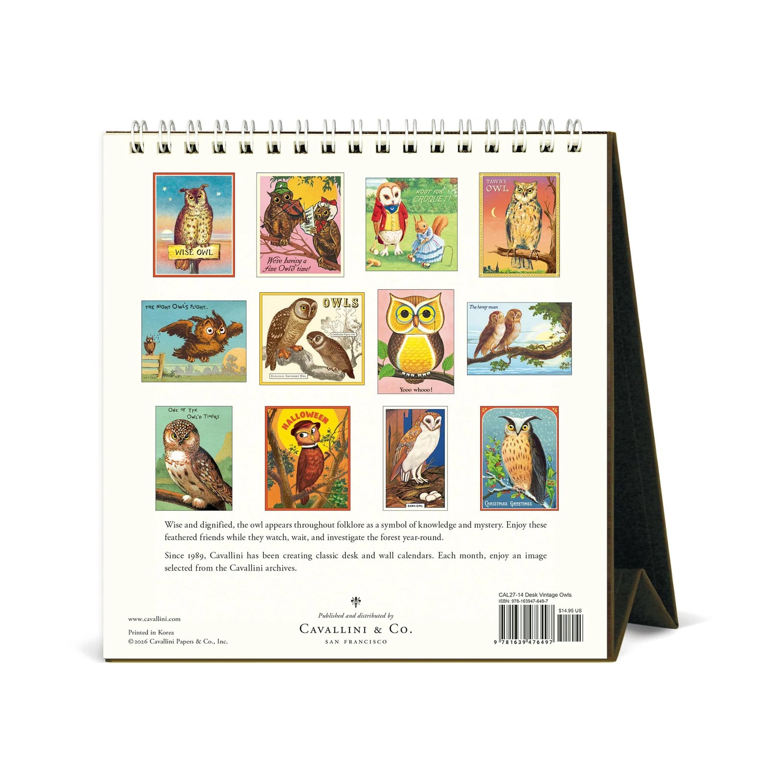 Vintage-style owl calendar page for 2027, showing a large illustrated owl perched on a sign that reads 'WISE OWL' against a blue and peach sky. The page is cream-colored with black text reading 'Vintage Owls 2027,' and the calendar is shown standing on its black side frame.