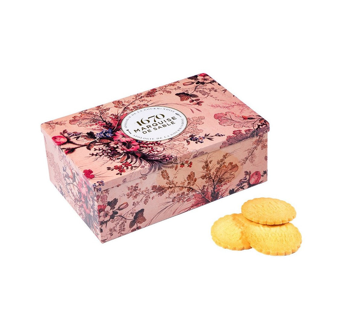 Treat yourself or a loved one to some elegant indulgence with this gorgeous cookie tin, featuring a vintage style floral design. This keepsake tin contains a delicious assortment of shortbread cookies, by French patisserie, La Sablésienne. La Sablésienne makes the real Sablé de Sablé-Sur-Sarthe cookies