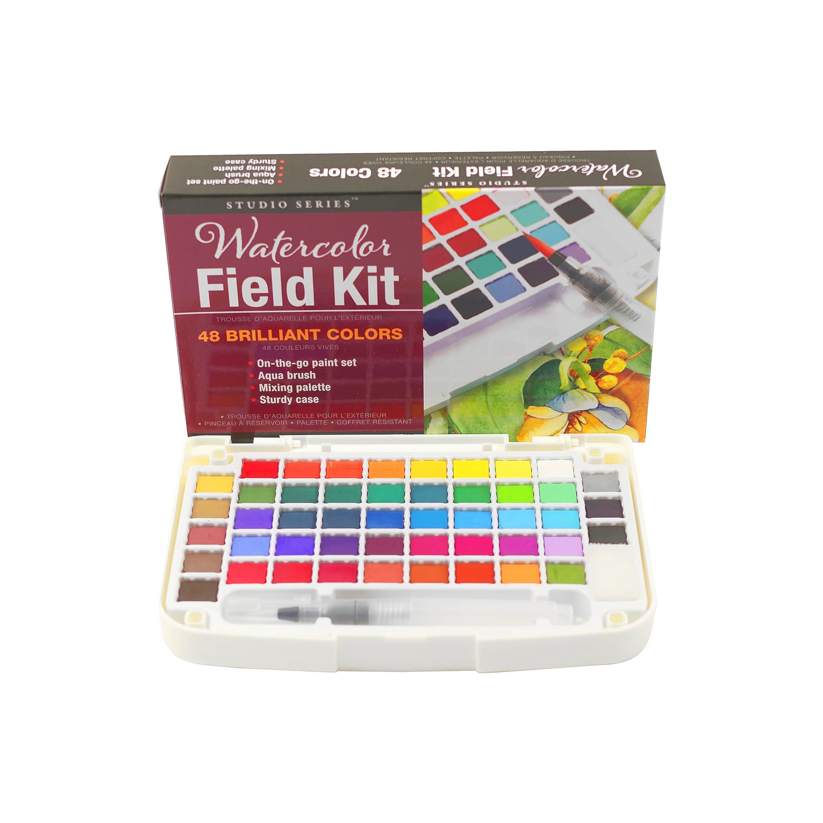 Studio Series Watercolor Field Kit with its retail box, showing a compact plastic watercolor palette with multiple color pans and a small brush in the front, photographed on a white background.