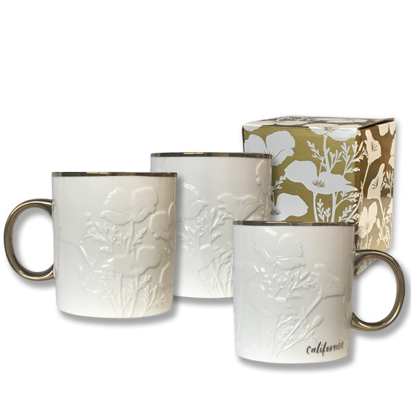 This strikingly elegant mug features California's state flower in white, tone on tone relief with and antique gold finish on the handle and rim, and 'California' in a calligraphic hand at the base. Presented in a poppy print gift box. Metallic gold on white stoneware 3.5" x 5.25" x 4" Dishwasher safe. 