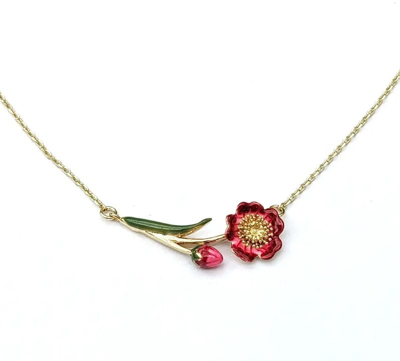 Necklace with a red floral pendant on a white background
