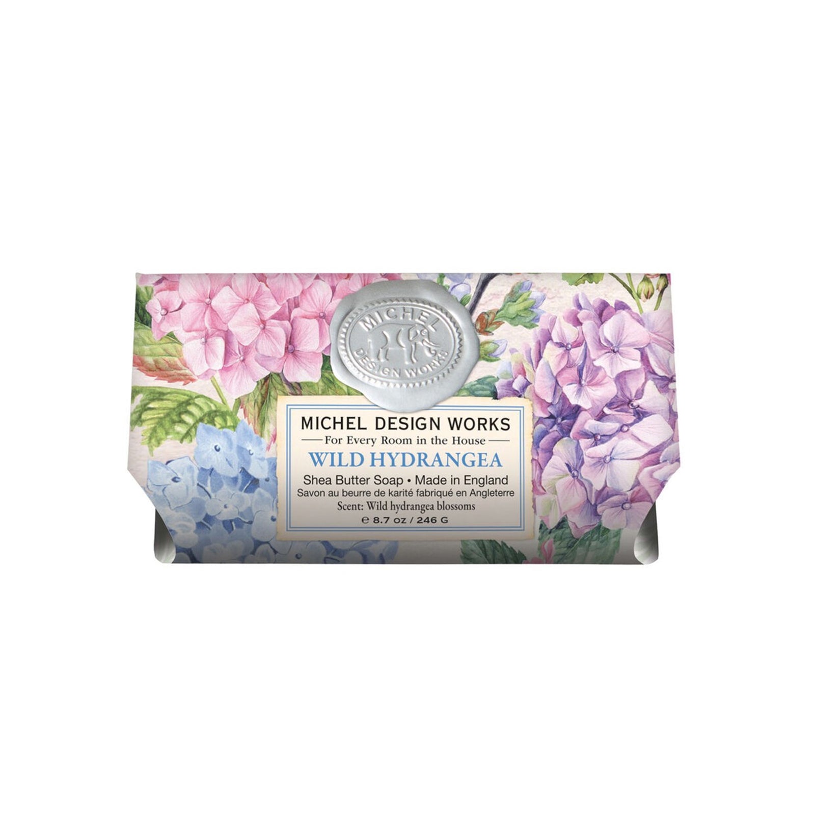 Bar of soap with floral packaging and label on a white background