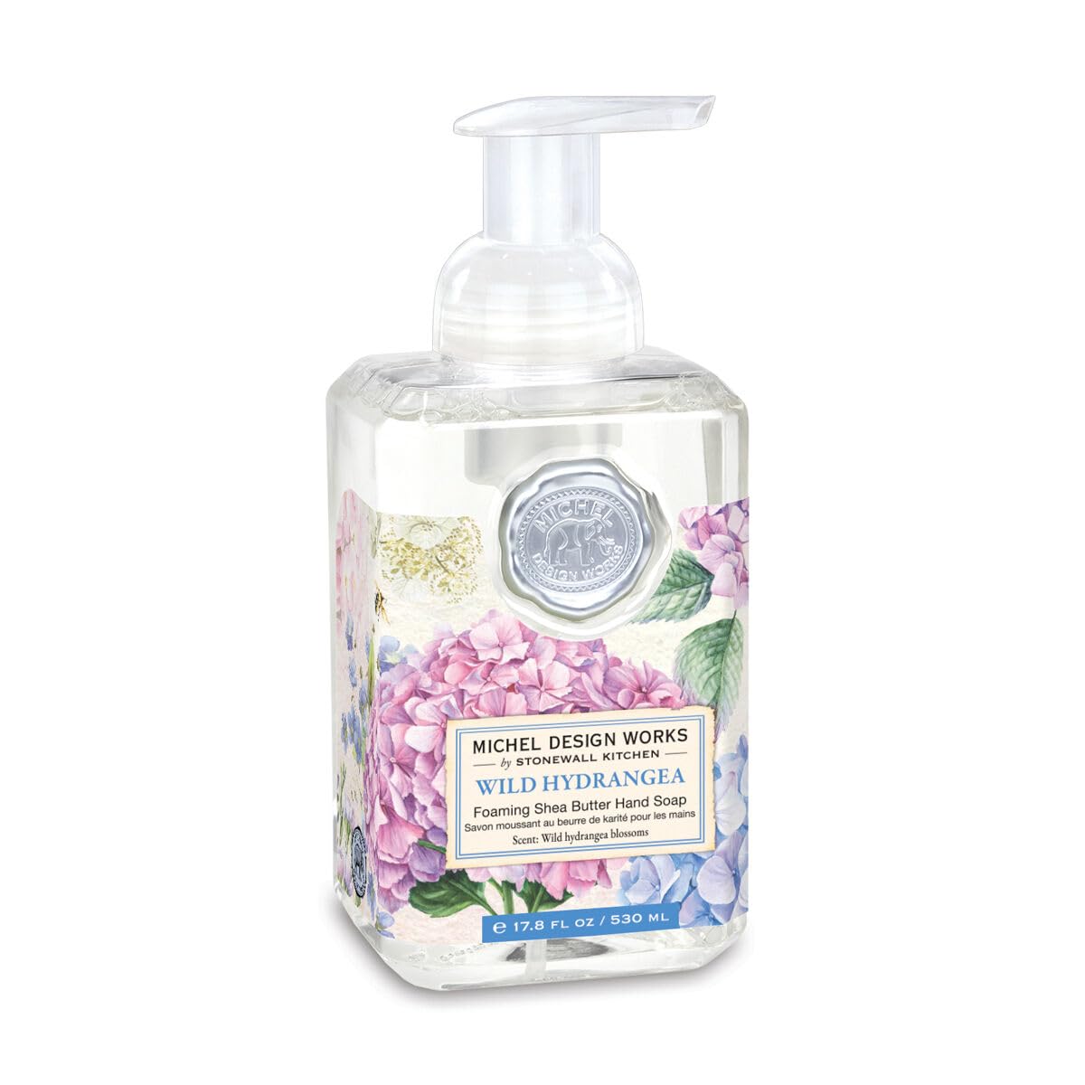 Foaming hand soap bottle with floral design on a white background
