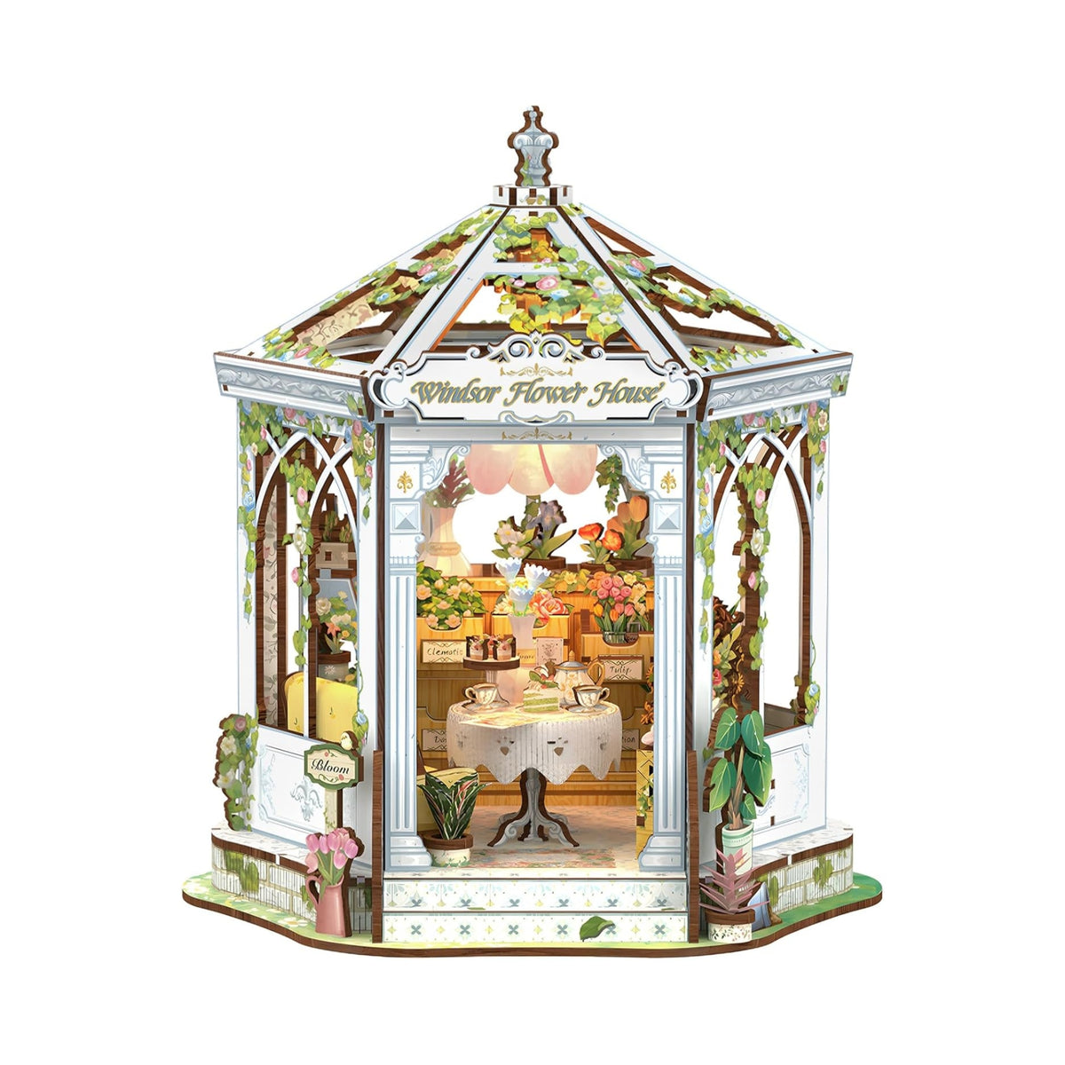 Decorative model of a garden gazebo with intricate details on a white background