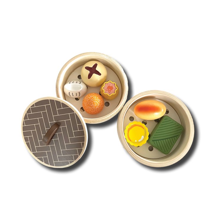 This wooden dim sum set will keep your child engaged for hours! Features 7 wooden food items and two wooden steamer baskets. Set contains 2 stackable steamers, 2 steamer papers, 1 steamer lid, 1 steamed pork dumpling, 1 shrimp dumpling, 1 BBQ pork bun, 1 lotus wrapped rice, 1 egg tart, 1 crispy dumpling, 1 sesame ball.