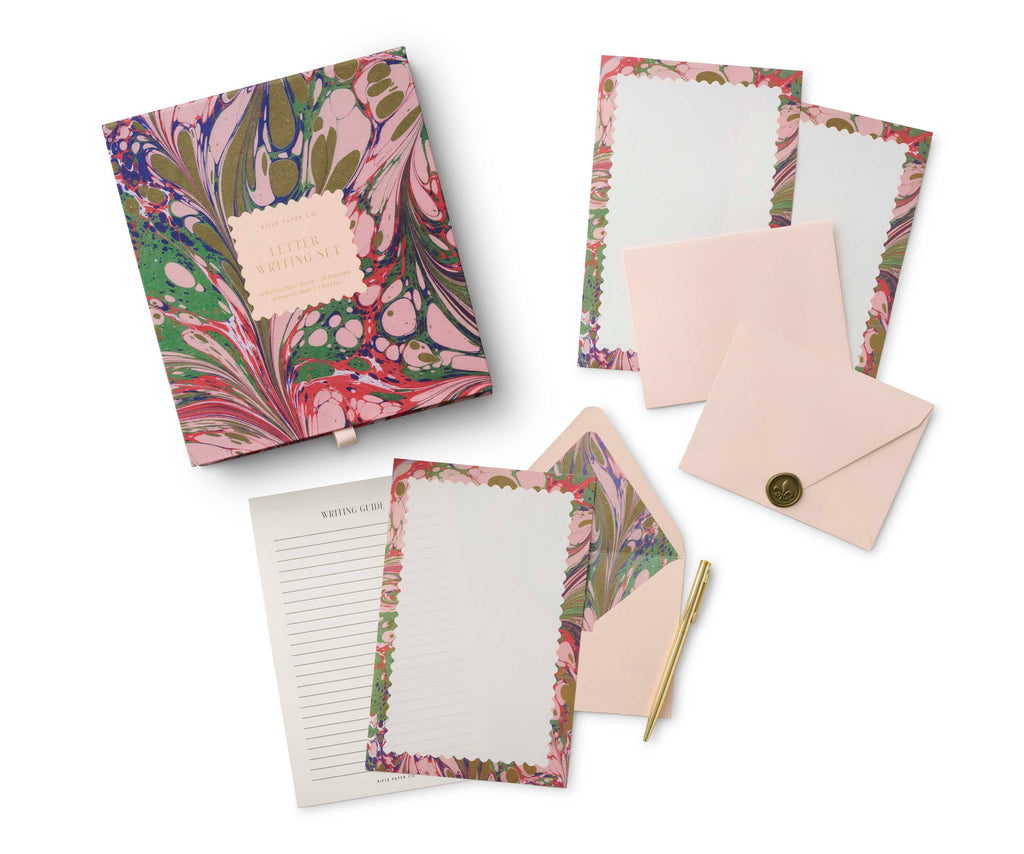 This beautiful, boxed letter writing set contains everything you need to keep up your correspondence, stylishly. It includes writing paper, envelopes, envelope seals and a gold pen, as well as a writing guide to help your letters look their best. Boxed letter writing set. Box dimensions: 8" x 9" x 1.5".