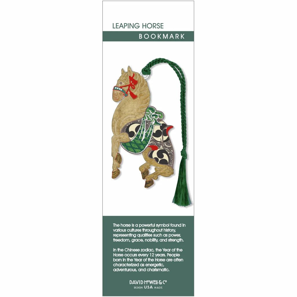 Decorative horse bookmark with a green tassel on a white background