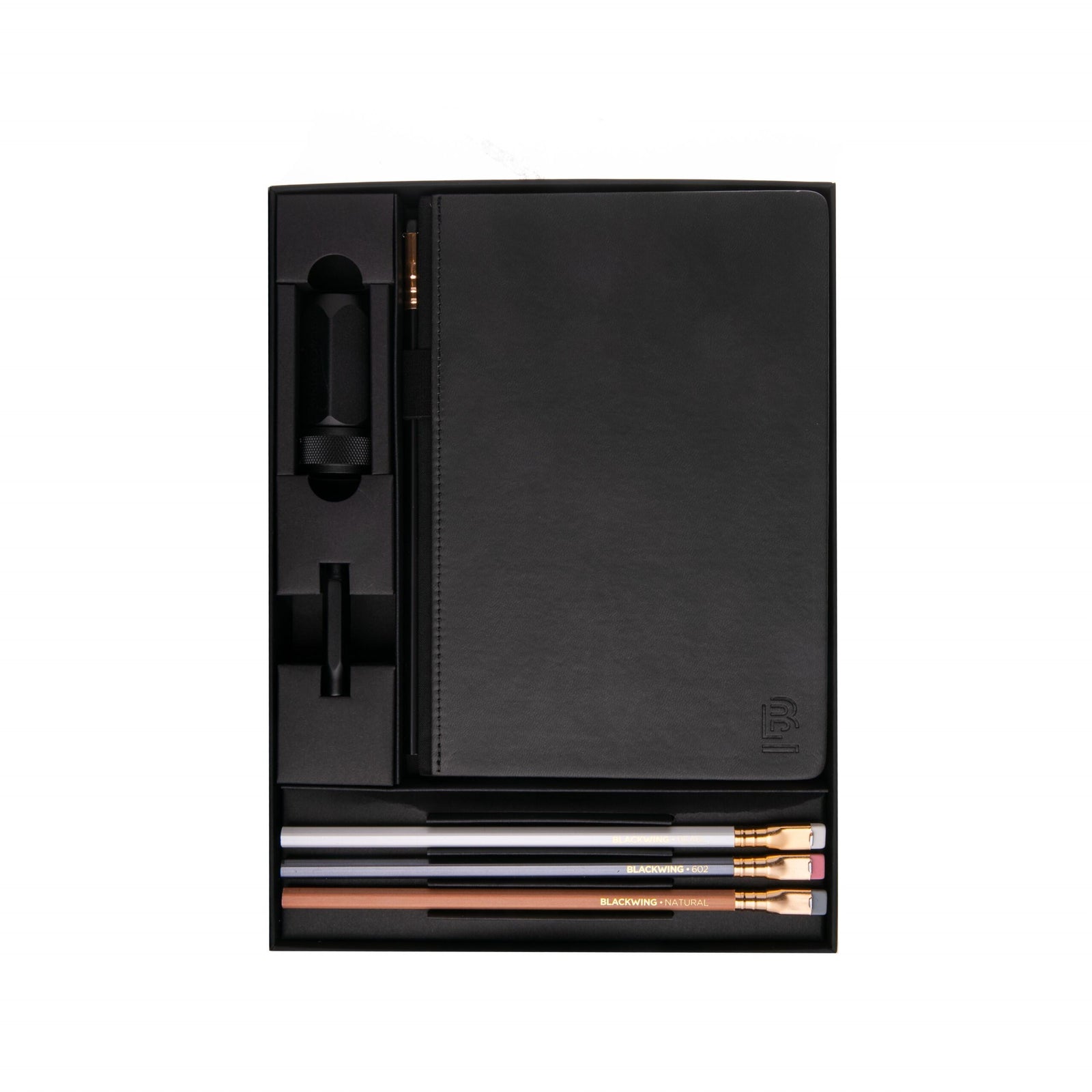 Looking for the ultimate notebook set for all your sketching needs? Whether you’re a seasoned artist or starting your artistic journey, this Dot Grid Sketching Notebook Set is a must-have. Set includes: 1 dot grid hardcover notebook with 160 pages of paper made for sketching in pencil, 4 graphite pencils in varying styles, 1 sharpener, 1 point guard to keep pencil points intact Notebook measures approximately 6" x 8" Matte-black hardcover notebook with dot grid 100 GSM paper