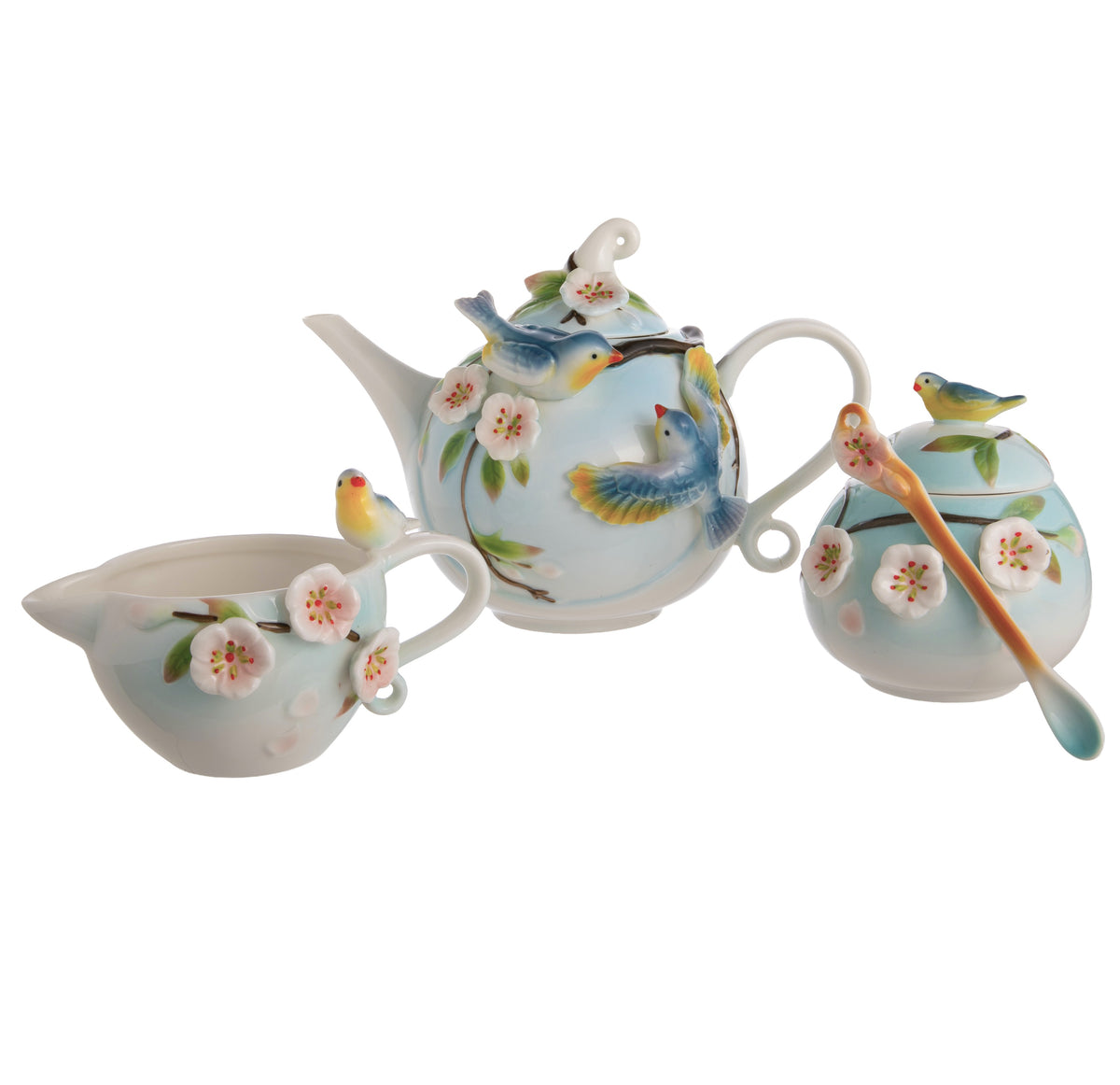 Ceramic tea set with bird and floral design on a white background