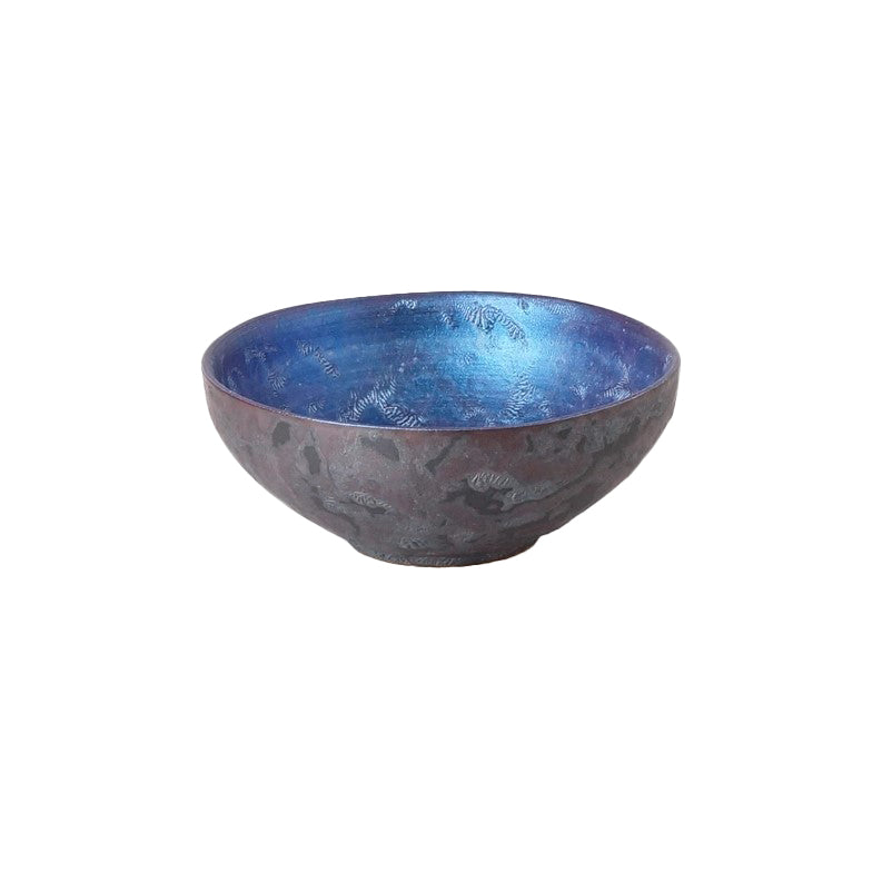 Handcrafted Arita ware is one of Japan's most popular porcelain art styles, renowned for its light yet durable quality. These striking yet simple bowls feature a hammered metal effect on the exterior and a pearl-metallic look on the inside, which reflects different color tones in different lights. Use these bowls for sake, soy sauce, or even as a chic trinket tray. 