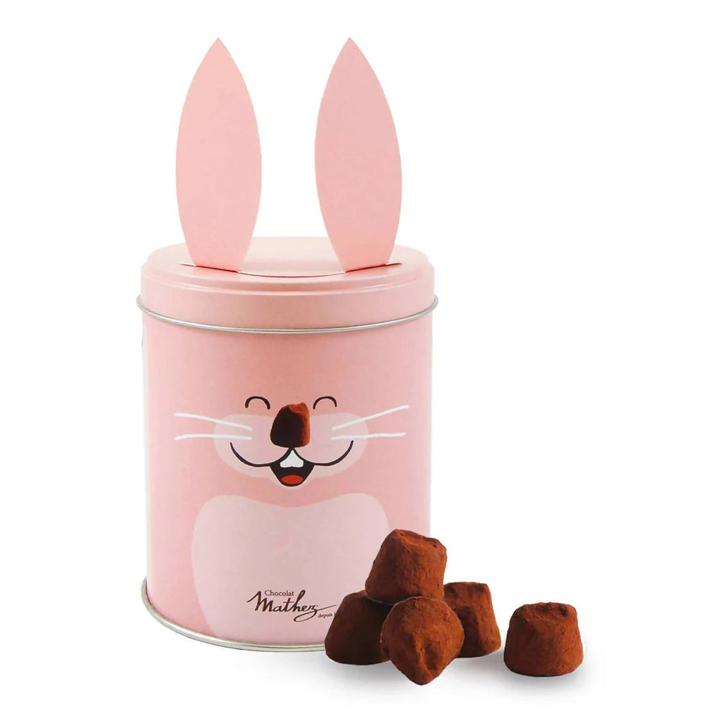 Indulge in the whimsical delight of chocolate truffles in an adorable rabbit-shaped tin! Each truffle is made with high-quality cocoa and crafted to melt smoothly. A surprise pop of crackling candy makes for a fun, festive treat. These truffles make an enchanting gift or a joyful treat for yourself.