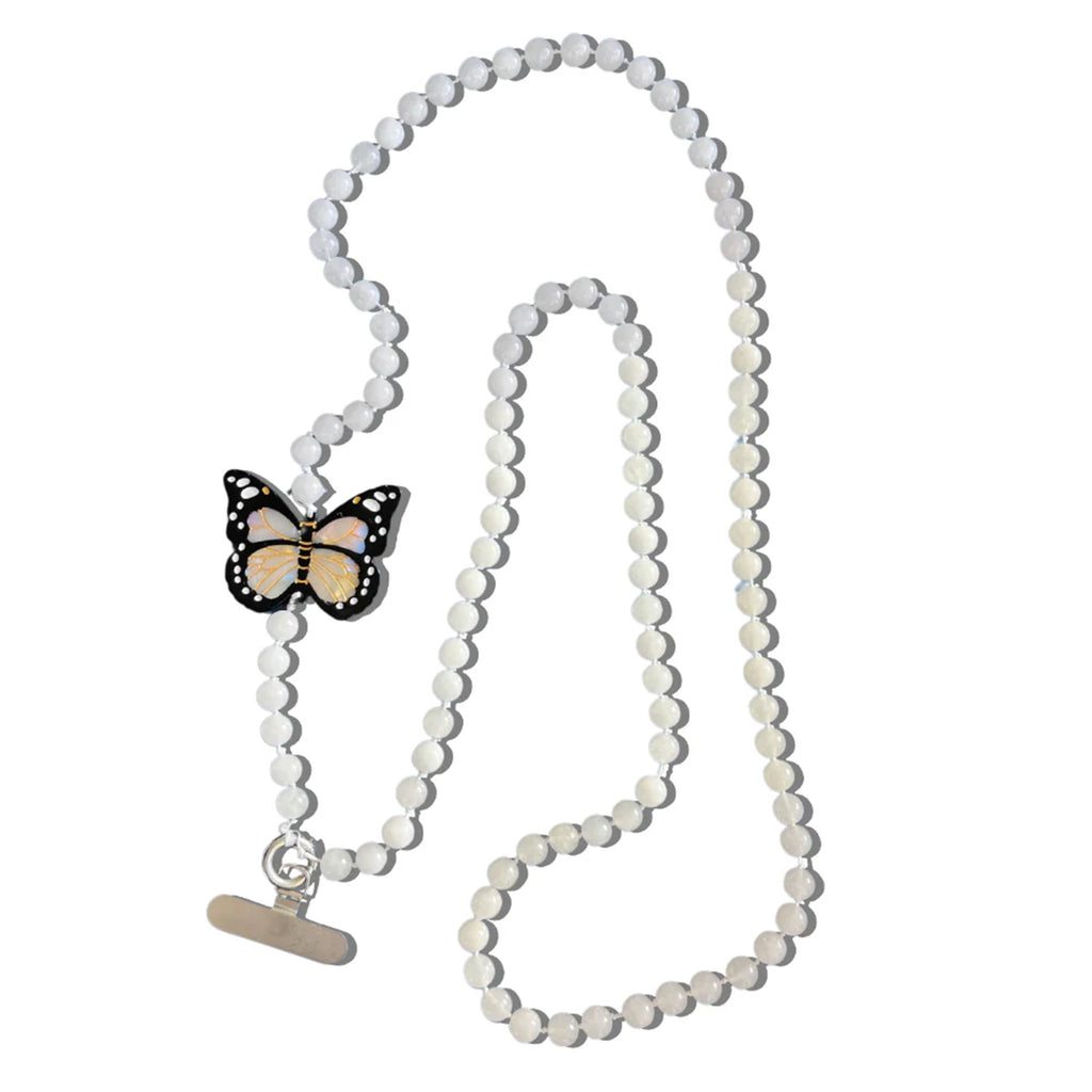 This crossbody chain is perfect for when you want to be hands-free and stylish! Each chain features over 100 natural gemstone beads and a hand-painted charm.