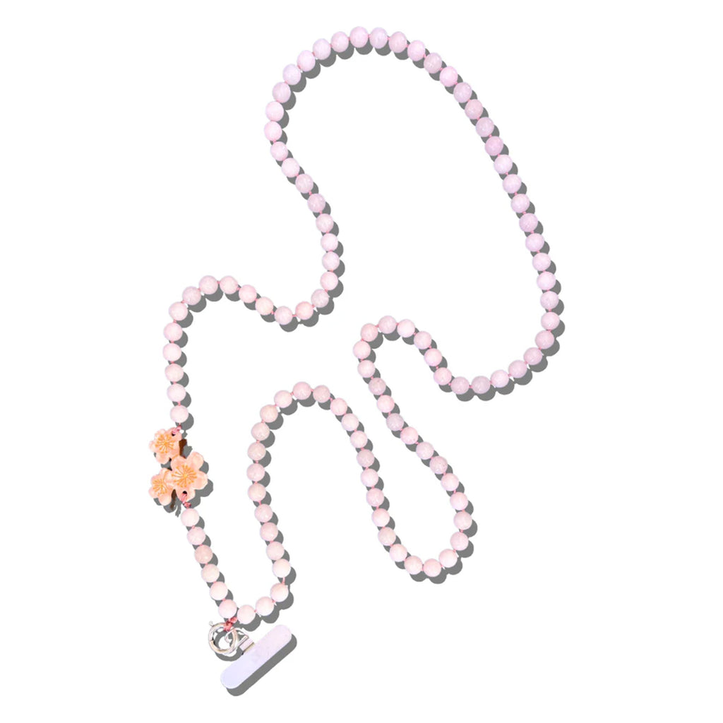 This crossbody chain is perfect for when you want to be hands-free and stylish! Each chain features over 100 natural gemstone beads and a hand-painted charm.