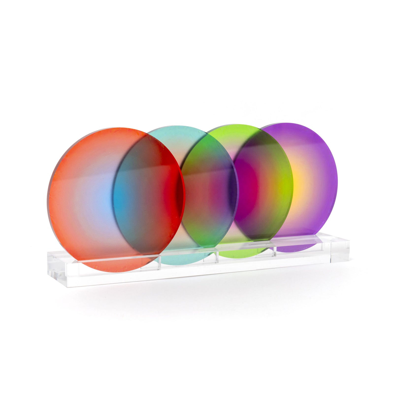 Graphic artist Yoni Alter looks to create products that can become works of art when not serving their functional purpose. With bright and bold colors, Yoni offers new and fresh ways to observe the everyday. Combining the graphic and artistic, the literal and the abstract, highlighting geometric space and form, his art is playful, positive, modern, and minimalist. This set of four-color gradient coasters conforms to this principle; they look just as good as a design piece, nestled in their clear acrylic sta