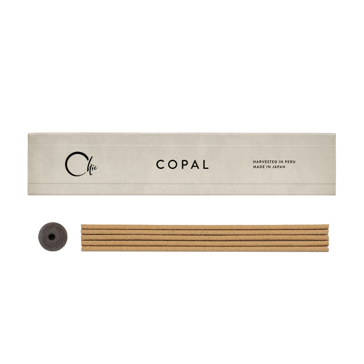 Copal incense packaging with sticks and roller on a white background