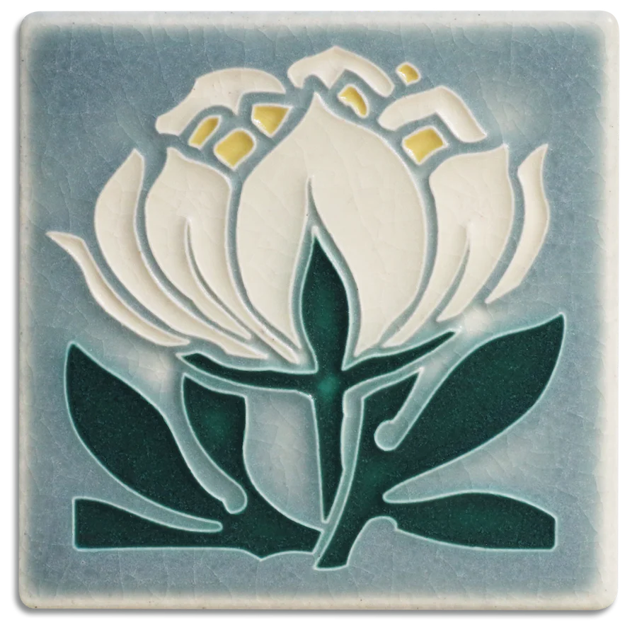 One of Nawal Motawi's favorite flowers, the peony is a recurring source of inspiration at Motawi Tileworks.  Actual Tile Size: Approximately 3 7/8” x 3 7/8”. As each Motawi tile is crafted by hand, dimensions may vary slightly by up to 1/16". Tiles are 5/8" thick and have a notch at the back for hanging. 
