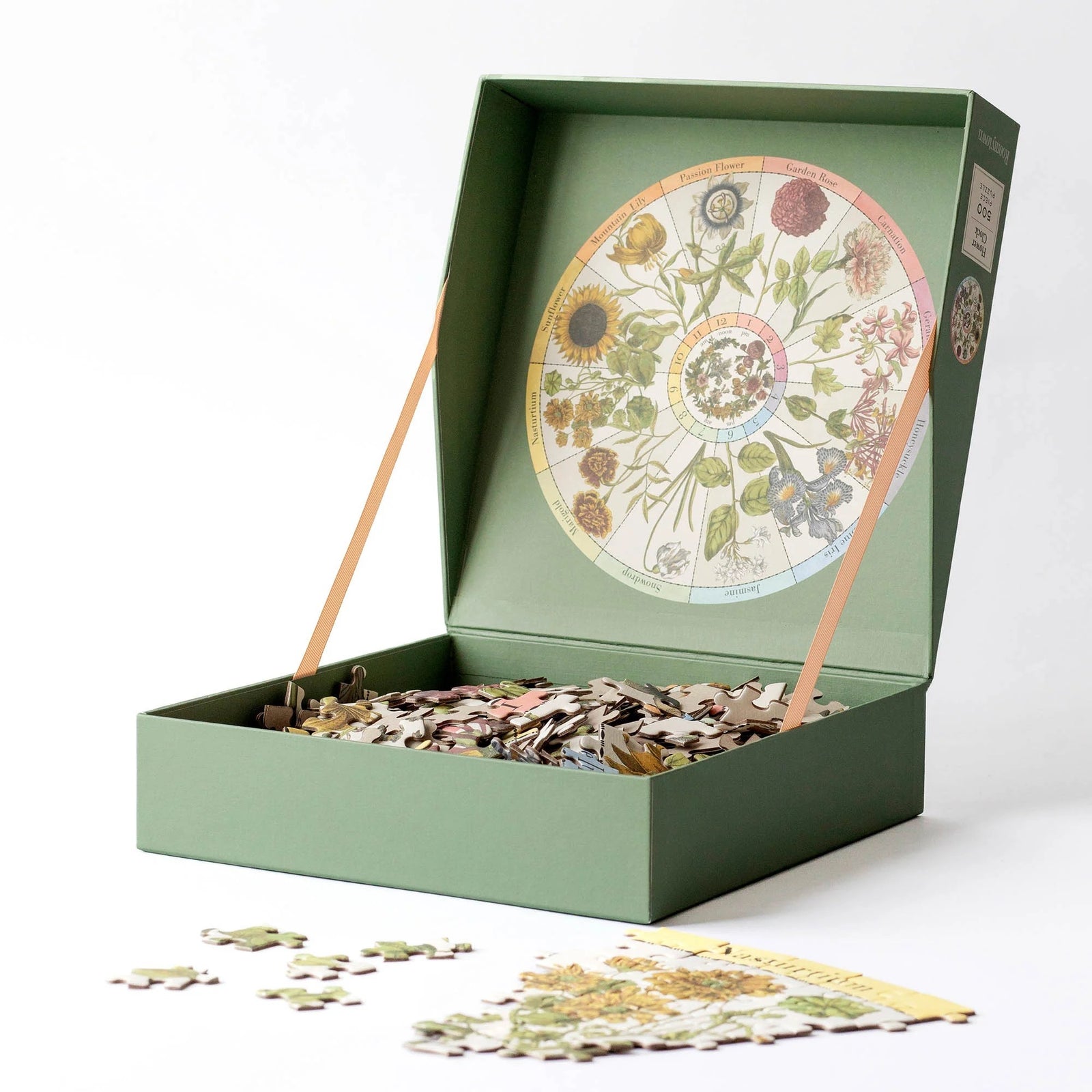 Puzzle box with Linnaean Flower Clock design on a white background