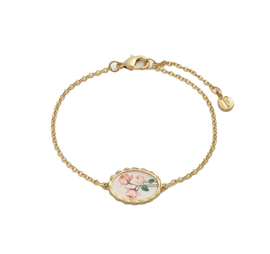 Adorn your wrist with this Framed Roses Bracelet, a piece of Victorian-inspired wearable art. Featuring Dr Robert John Thornton’s painted rose illustrations set in a timeless gold-tone oval hand-carved frame, this delicate chain bracelet is perfect for adding a touch of elegance to your library visits or art gallery tours