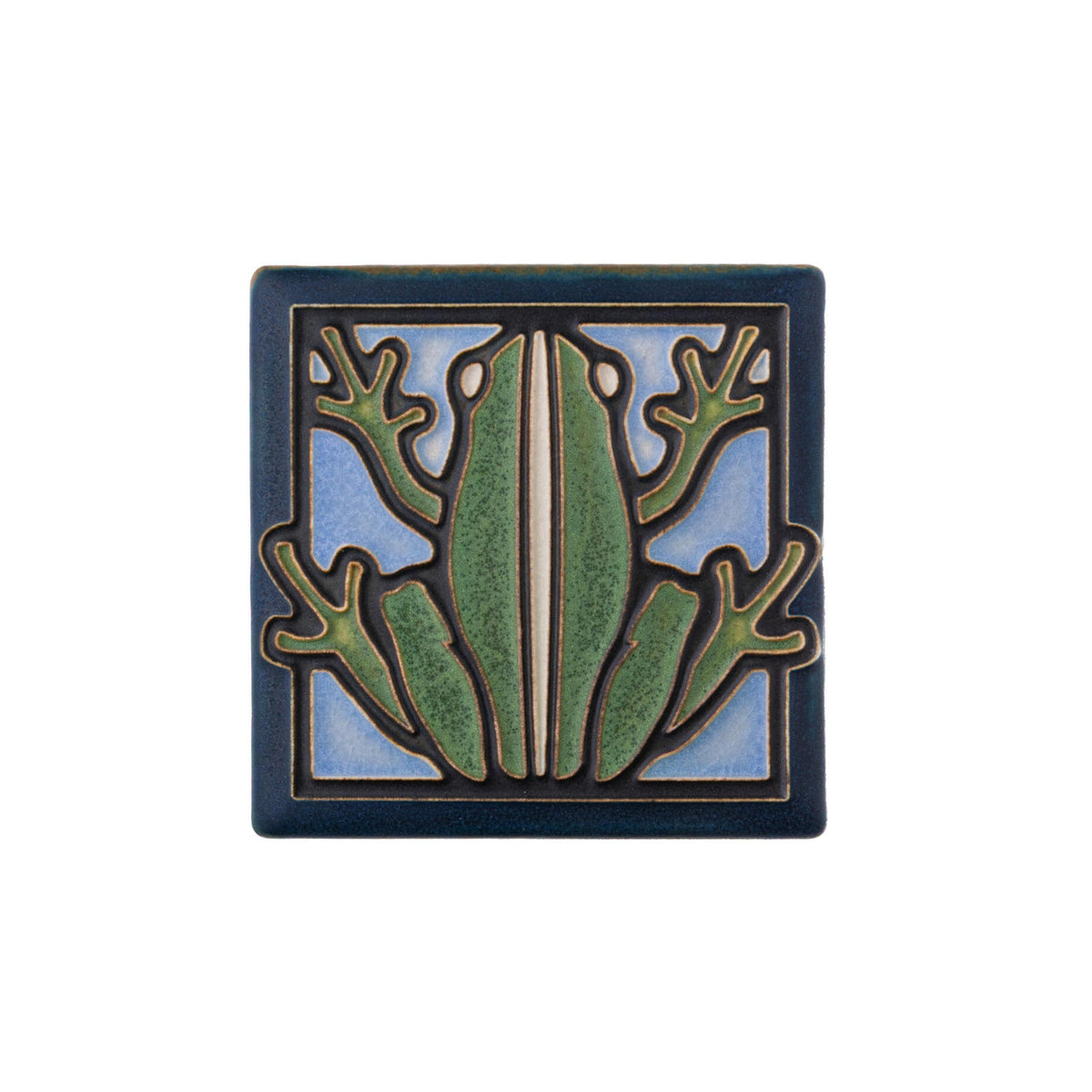 This delightful Motawi Tileworks tile depicts a moss green frog with a light blue background, rendered in a classic Arts &amp; Crafts style.