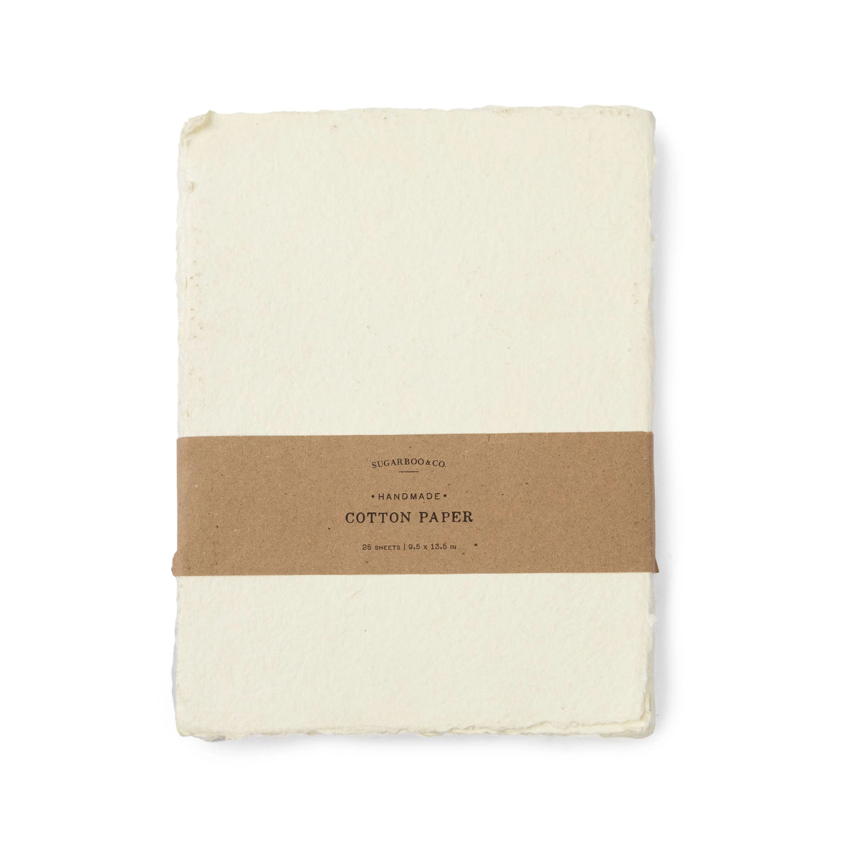 Folded cream-colored cotton paper with a brown band and text on a white background