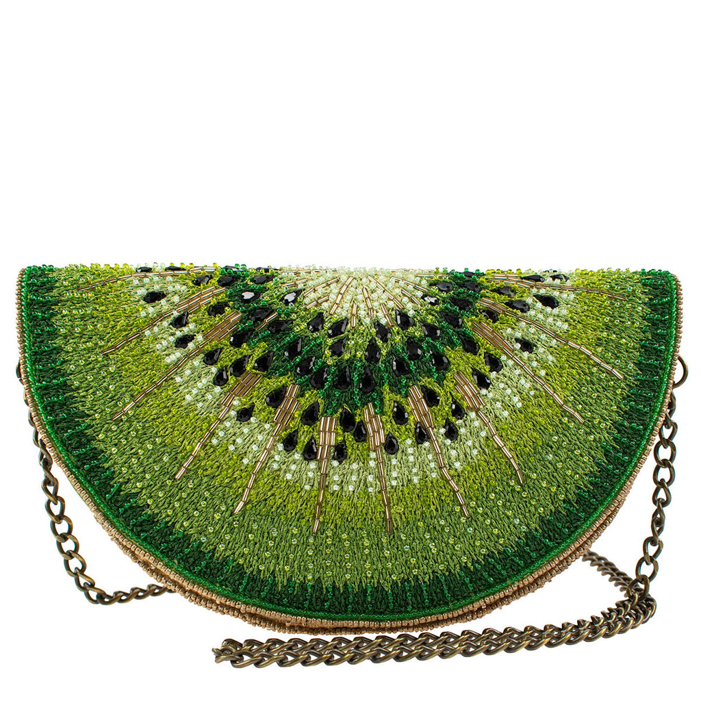 Fruity, fresh and fun! Add a pop of color to your wardrobe with this kiwi slice shaped purse. Hand-beaded and embroidered in exquisite detail - so realistic you'll be tempted to take a bite! Dimensions: 9.25" x 3.5" x 5" Strap length end to end: 49". This is a handmade item, each one an individual work of art. 
