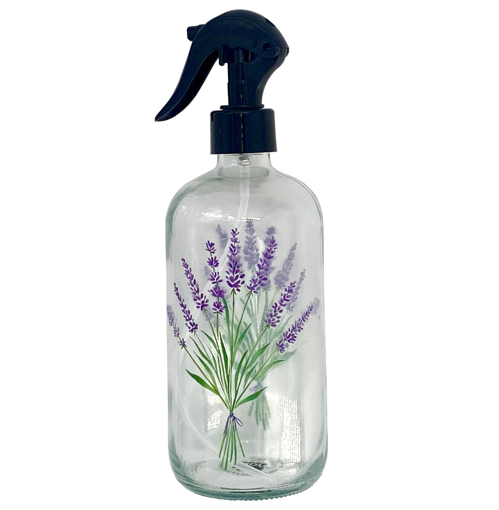 Stunning in its simplicity, this clear glass spray bottle features a pretty lavender sprig motif. Reusable and refillable, this glass spray bottle makes cleaning, or misting your house plants a prettier proposition. The plastic nozzle has a locking mechanism for convenience and safety. Dimensions: Diameter: 2.75" x 8.5" Material: Body: 100% Soda-Lime glass. Nozzle: 100% Polypropylene Care Instructions: Hand wash only. Capacity: 16 oz